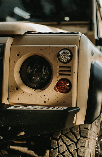 Close up on front light assembly on a Landrover.