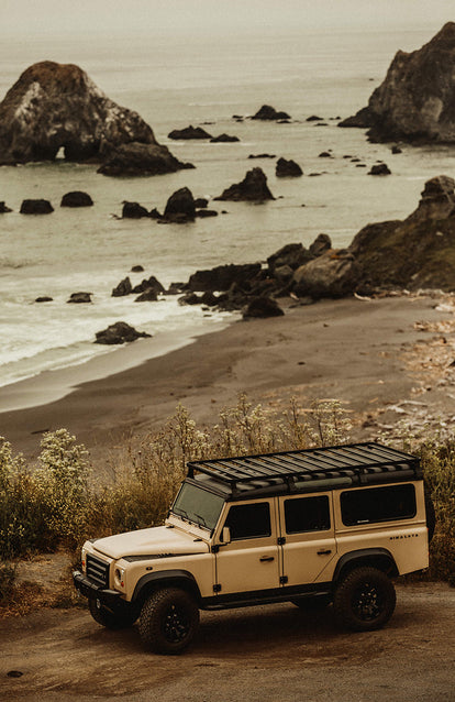 Drivable Automotive ArtworkA Landrover parked overlooking a rocky ocean bay.