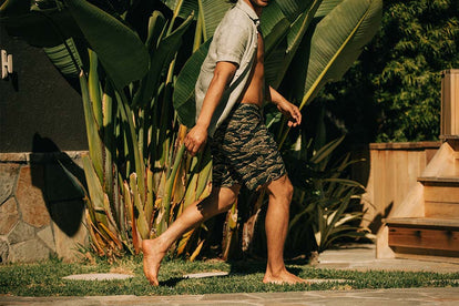 Model walking in The Adventure Short in Tiger Camo.