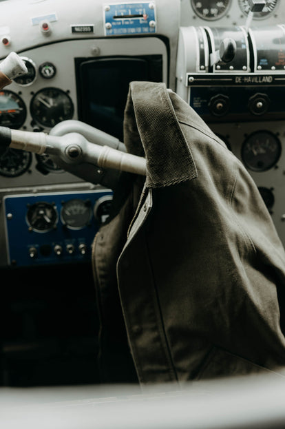 The Workhorse Jacket hanging off the control wheel of a seaplane